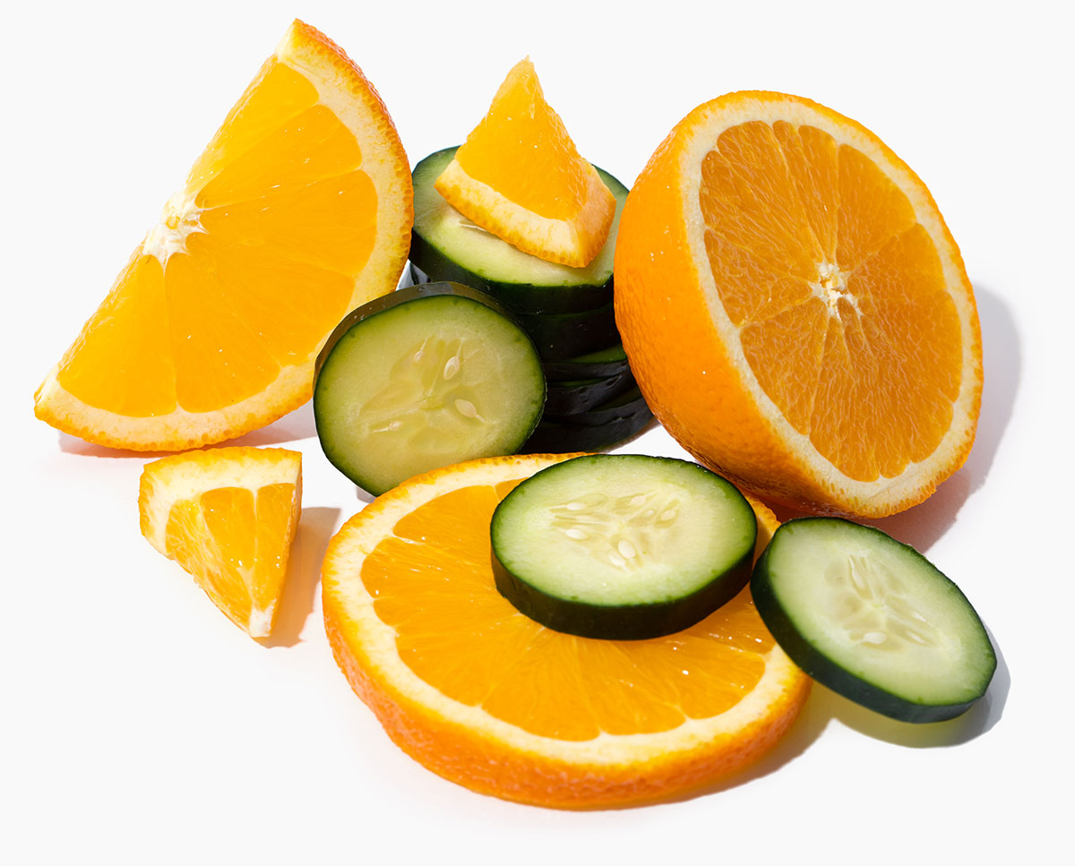 a grouping or orange and cucumber slices